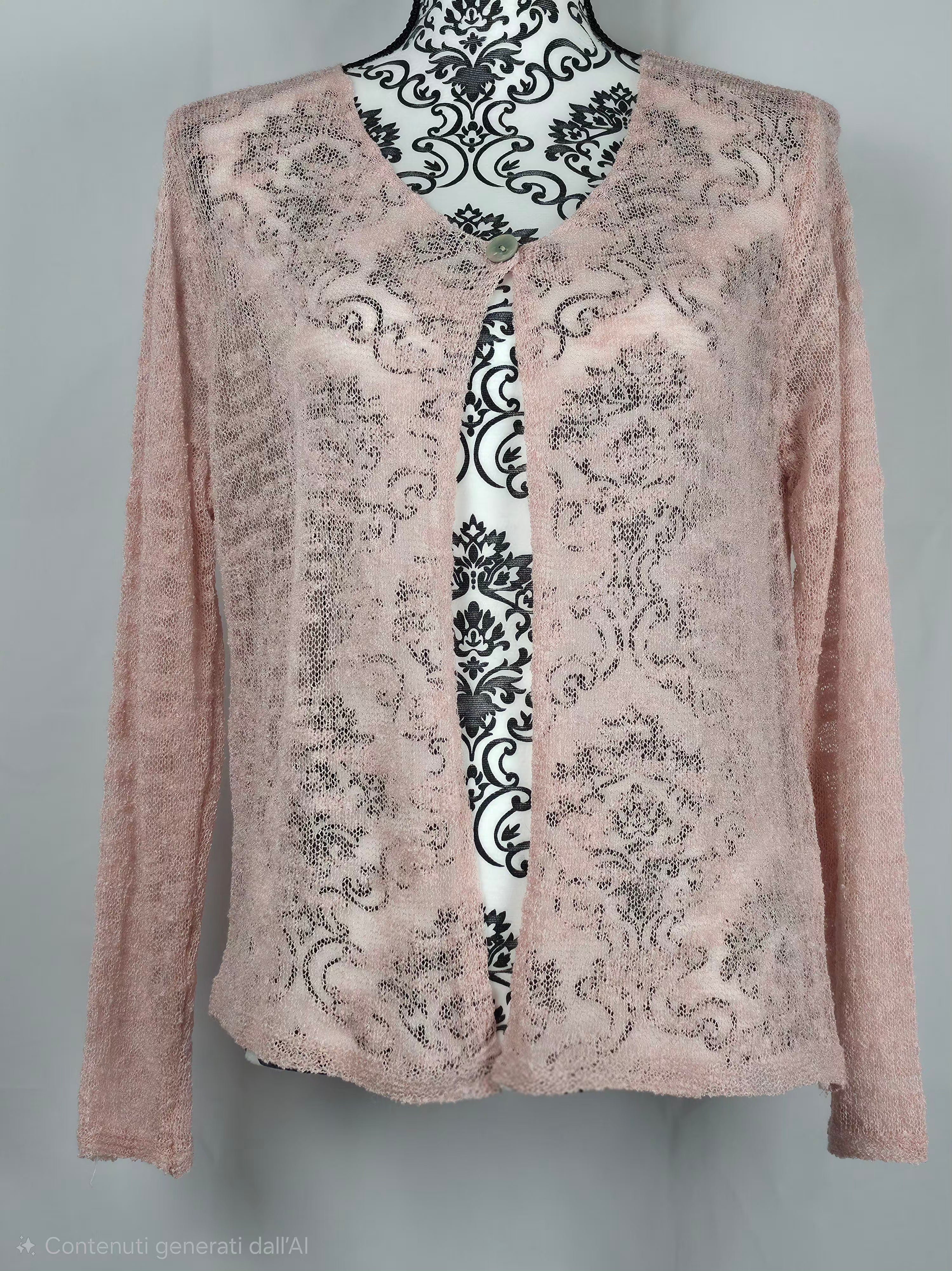 Maglia aperta lavorata a rete con texture traforata